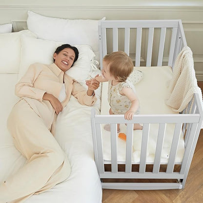 EvoNest Baby Crib, 6 in 1 Convertible Mini Crib with Wheels, 100% New Zealand Solid Wood Growing Bed, 4 Adjustable Mattress Height，White